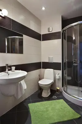 a bathroom with a sink and a toilet and a shower at Anita Guest House & Relax in Perushtitsa