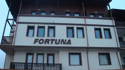 a building with the words forkuniya written on it at Ski Lift Apartment - FORTUNA in Bansko