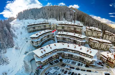 an aerial view of a resort in the snow at Yeti Apartment Pamporovo Grand Monastery in Pamporovo