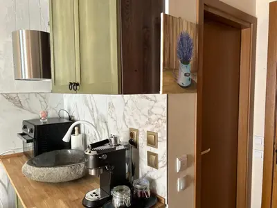 a kitchen with a coffee maker on a counter at Bambi in Pamporovo