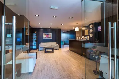a living room with a couch and a table at Aspen Apartment A409 3OOm from Gondola in Bansko