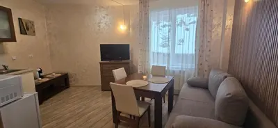a living room with a couch and a table at Forest Dreams in Pamporovo