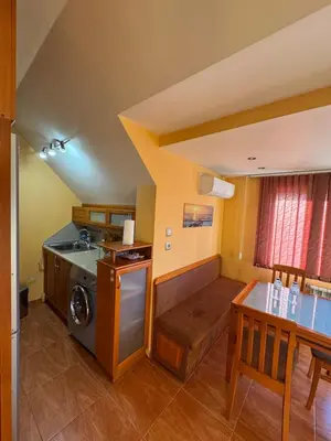 a kitchen with a washer and dryer in a room at Mall Bulgaria Apartment in Sofia