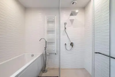 a bathroom with a shower and a glass shower stall at Luxurious House in an Exclusive Complex, Mount View in Sofia