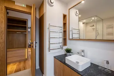 a bathroom with a sink and a mirror at Luxurious House in an Exclusive Complex, Mount View in Sofia