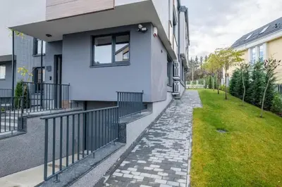a house with a stone walkway next to a building at Luxurious House in an Exclusive Complex, Mount View in Sofia