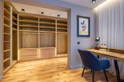 a dressing room with a desk and a blue chair at Luxurious House in an Exclusive Complex, Mount View in Sofia