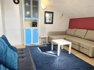 a living room with a couch and a table at The Little Pearl of Sofia in Sofia