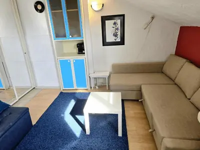 a living room with a couch and a table at The Little Pearl of Sofia in Sofia