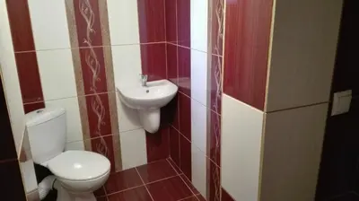 a bathroom with a toilet and a sink at ViBo Guesthouse in Sapareva Banya