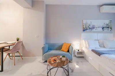 a living room with a couch and a table at Luxury Studios in Top Center in Sofia