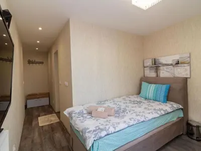 a small bedroom with a bed in a room at MezonetCentre in Sofia