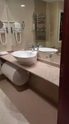 a bathroom with two sinks and a large mirror at Downtown Resort Bansko- Eliko Suite in Bansko