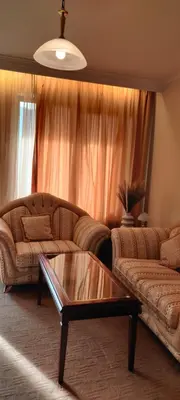 a living room with a couch and a coffee table at Downtown Resort Bansko- Eliko Suite in Bansko