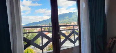 a window with a view of a mountain at Banderitsa Hotel and Casino in Bansko