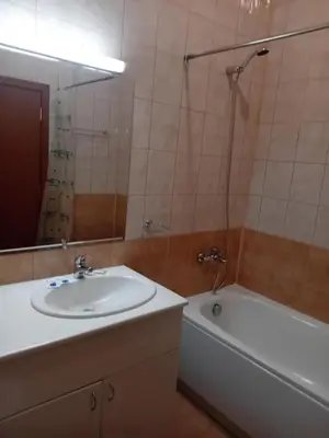 a bathroom with a sink and a bath tub at STUDIO B&K in FLORA BOROVETS in Borovets