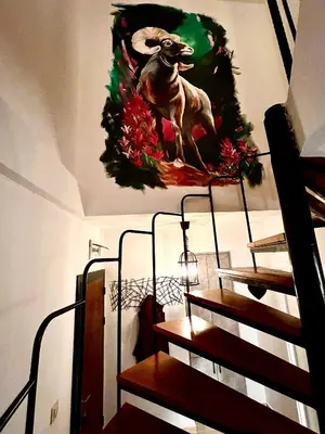 a christmas wreath on the wall of a room at CozyHomes in Bansko