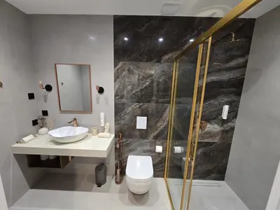 a bathroom with a shower and a toilet and a sink at Луксозни делукс стаи Мечката in Botevgrad