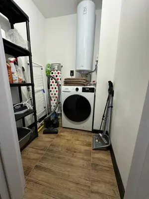 a kitchen with a stove and a microwave at MonarX Suites 1113 in Bansko