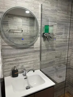 a bathroom with a sink and a mirror at MonarX Suites 1113 in Bansko