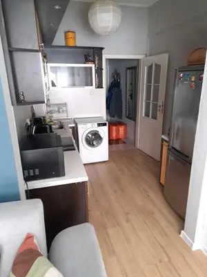 a kitchen with a sink and a washing machine at Apartment Sofia top center in Sofia