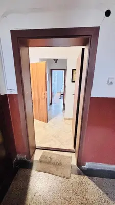 a doorway into a room with a mirror and a hallway at Cozy Suite Vitosha street Center in Sofia