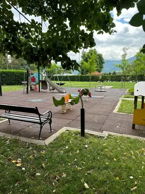 a park with a park bench and a playground at Pravets Lake Home away from home in Pravets