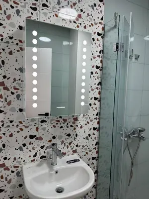 a bathroom with a sink and a mirror at Lovely Stylish Brand New Flat in Sofia