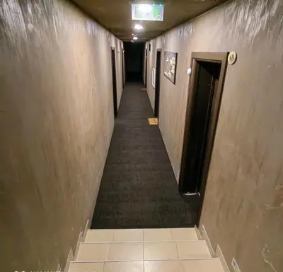 a long hallway with a long aisle with a hallway at Ski cosy apartment 5 in Bansko