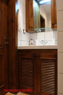 a bathroom with a sink and a mirror at Banskodom in Bansko