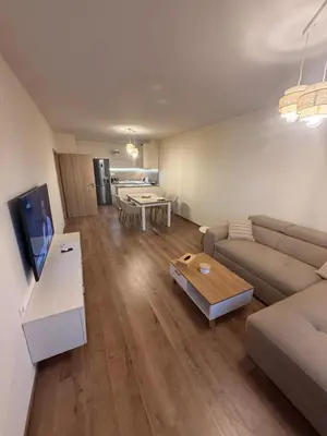 a living room with a couch and a table at PanOrama Luxury Apartments in Panagyurishte