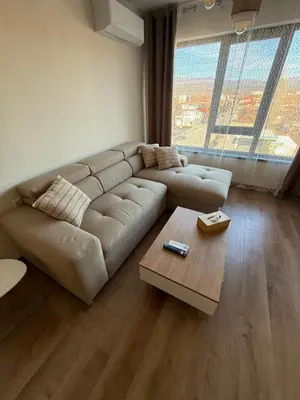 a living room with a couch and a coffee table at PanOrama Luxury Apartments in Panagyurishte