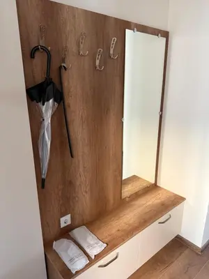 a bathroom with a mirror and an umbrella at PanOrama Luxury Apartments in Panagyurishte