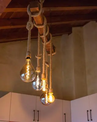 a chandelier hanging from a ceiling in a kitchen at Host2U Penthouse 2-Bedrooms The Best View - Free Parking in Bansko