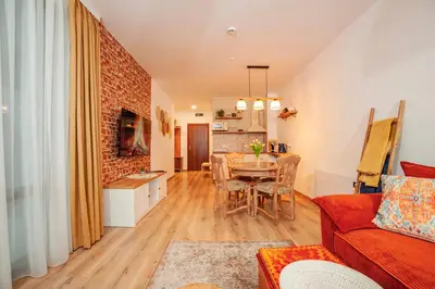 a living room with a couch and a table at Golden Lake 526 at Oak Residence in Smolyan