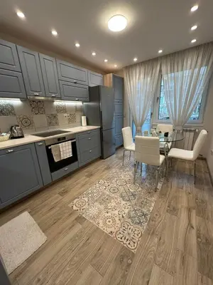 a kitchen with a table and a dining room at Cozy Apartment in the Heart of Sofia, BG in Sofia