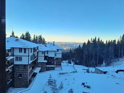 a group of buildings in the snow at Студио Алтом in Pamporovo