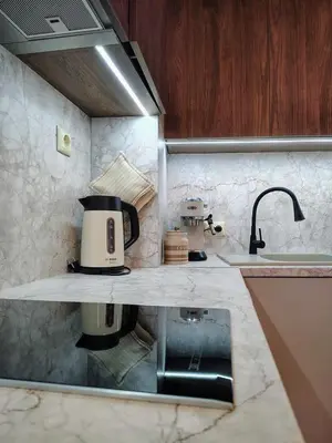 a kitchen with a counter with a coffee maker on it at Great view studio Pirin Palace in Bansko