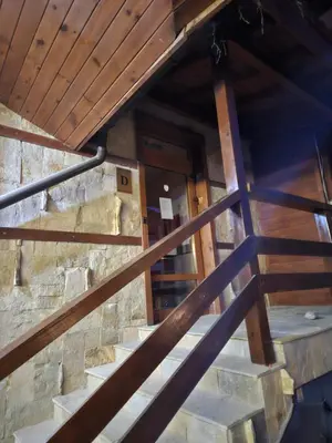 an overhead view of a staircase with wooden railings at ELIA Apartment in Bansko