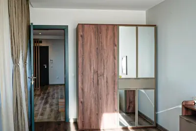 a room with a sliding glass door in a room at Апартамент за Гости Танчеви in Karlovo