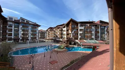a large apartment complex with a swimming pool and buildings at Belvedere Holiday Club F403 in Bansko