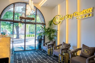 a waiting room with chairs and a sign that reads cruelty buffet at Capital City Center Apart Residence in Plovdiv