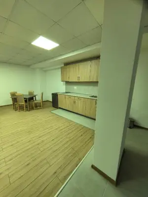 an empty room with a table and chairs in it at Apartament Bellisimo in Sofia