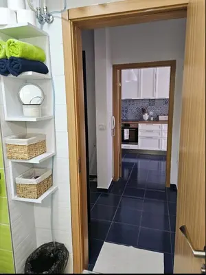a kitchen with a door open to a room at Boutique Apartment blue 3 in Plovdiv