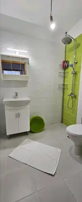 a bathroom with a shower and a sink and a toilet at Boutique Apartment blue 3 in Plovdiv