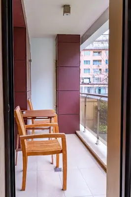 a pair of chairs and a table on a balcony at Best Western Plus Olives City Hotel - Free Pool & Parking in Sofia