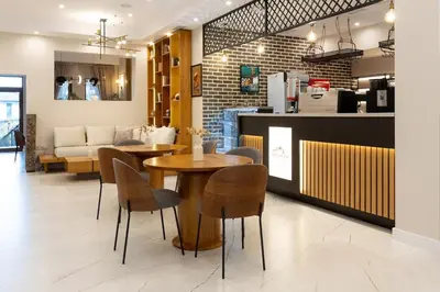a restaurant with two tables and chairs and a counter at Divine mountain studio - parking - SPA in Bansko