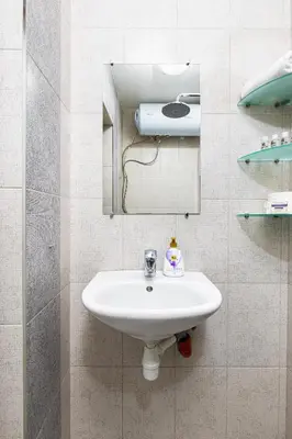 a bathroom with a sink and a mirror at The Crash Pad Studio by Flat Mаnager in Plovdiv