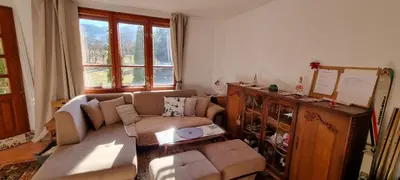 a living room with a couch and a table at BoroVille in Raduil