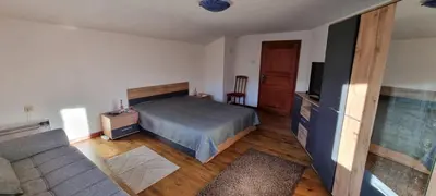 a bedroom with a bed and a flat screen tv at BoroVille in Raduil
